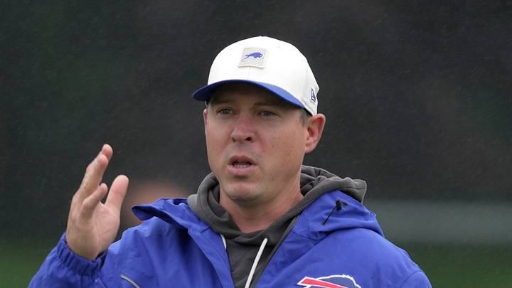 Bills defense coordinator Jim Leonhard talks to someone on the sidelines before practice at Bills Training Camp at St. John Fisher University in Pittsford on Aug. 13 2026. Bills defense coordinator Jim Leonhard talks to someone on the sidelines before practice at Bills Training Camp at St. John Fisher University in Pittsford on Aug. 13 2026.