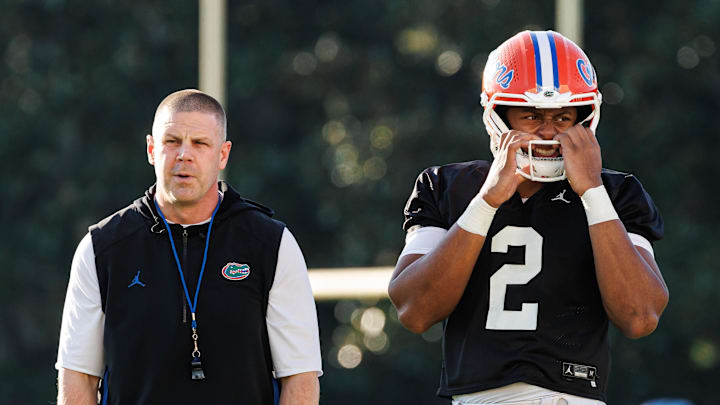 Florida Gators head coach Billy Napier and Florida Gators quarterback DJ Lagway (2) watch during spring football practice at Heavener Football Complex at the University of Florida in Gainesville, FL on Thursday, March 6, 2025. [Matt Pendleton/Gainesville Sun]