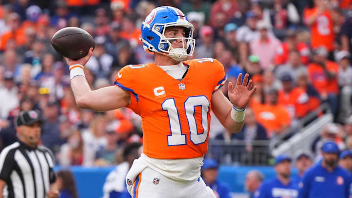 Oct 26, 2025; Denver, Colorado, USA; Denver Broncos quarterback Bo Nix (10) throws a pass against the Dallas Cowboys in the second half at Empower Field at Mile High. 