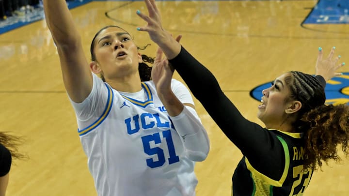 Dec 7, 2025; Los Angeles, California, USA; UCLA Bruins center Lauren Betts (51) drives past Oregon Ducks forward Sarah Rambus (23) for a basket during the first half at Pauley Pavilion presented by Wescom Financial. Mandatory Credit: Jayne Kamin-Oncea-Imagn Images Dec 7, 2025; Los Angeles, California, USA; UCLA Bruins center Lauren Betts (51) drives past Oregon Ducks forward Sarah Rambus (23) for a basket during the first half at Pauley Pavilion presented by Wescom Financial. Mandatory Credit: Jayne Kamin-Oncea-Imagn Images