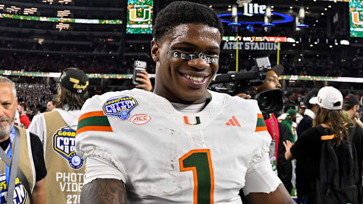 Dec 31, 2025; Arlington, TX, USA; Miami Hurricanes wide receiver Joshisa Trader (1) celebrates after the 2025 Cotton Bowl and quarterfinal game of the College Football Playoff at AT&T Stadium. Mandatory Credit: Jerome Miron-Imagn Images