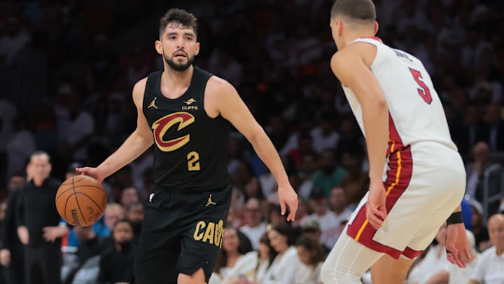 Apr 26, 2025; Miami, Florida, USA; Cleveland Cavaliers guard Ty Jerome (2) dribbles the basketball as Miami Heat forward Nikola Jovic (5) defends in the first quarter during game three for the first round of the 2025 NBA Playoffs at Kaseya Center. Mandatory Credit: Sam Navarro-Imagn Images