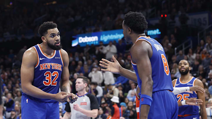 Jan 3, 2025; Oklahoma City, Oklahoma, USA; New York Knicks center Karl-Anthony Towns (32) talks with forward OG Anunoby (8) after a play against the Oklahoma City Thunder during the second half at Paycom Center. Mandatory Credit: Alonzo Adams-Imagn Images