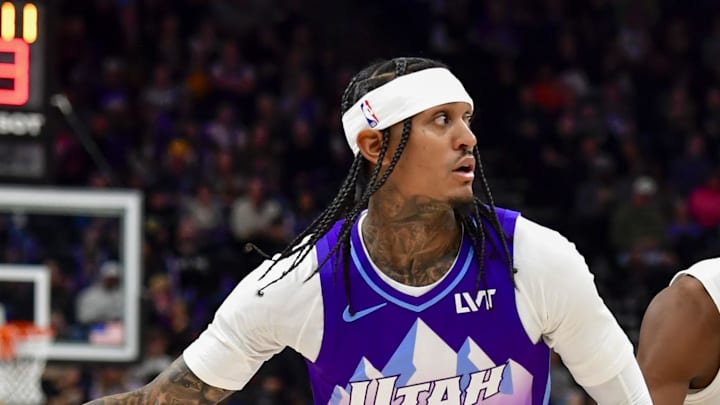 Utah Jazz guard Jordan Clarkson looks to pass against Cleveland Cavaliers forward De'Andre Hunter.