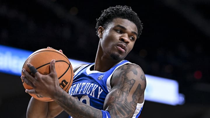 Mar 3, 2026; College Station, Texas, USA; Kentucky Wildcats guard Otega Oweh (00) secures a rebound during the second half against the Texas A&M Aggies at Reed Arena. Mandatory Credit: Maria Lysaker-Imagn Images 