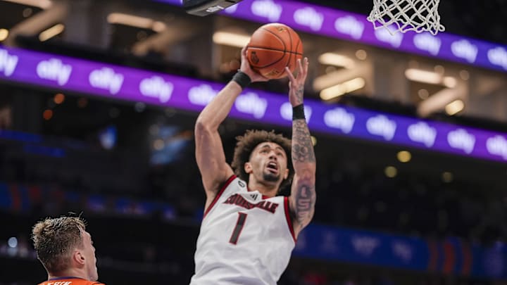 Mar 14, 2025; Charlotte, NC, USA; Louisville Cardinals guard J'Vonne Hadley (1) goes to the basket against the Clemson Tigers during the second half at Spectrum Center. Mandatory Credit: Jim Dedmon-Imagn Images Mar 14, 2025; Charlotte, NC, USA; Louisville Cardinals guard J'Vonne Hadley (1) goes to the basket against the Clemson Tigers during the second half at Spectrum Center. Mandatory Credit: Jim Dedmon-Imagn Images
