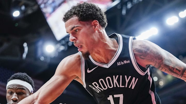 Oct 17, 2025; Toronto, Ontario, CAN; Brooklyn Nets forward Michael Porter Jr. (17) and Toronto Raptors guard Ja'Kobe Walter (14) battle for the ball during the third quarter  at Scotiabank Arena. Mandatory Credit: Kevin Sousa-Imagn Images