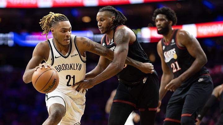 Dec 23, 2025; Philadelphia, Pennsylvania, USA; Brooklyn Nets forward Noah Clowney (21) dribbles against Philadelphia 76ers forward Jabari Walker (33) during the first quarter at Xfinity Mobile Arena. Mandatory Credit: Bill Streicher-Imagn Images
