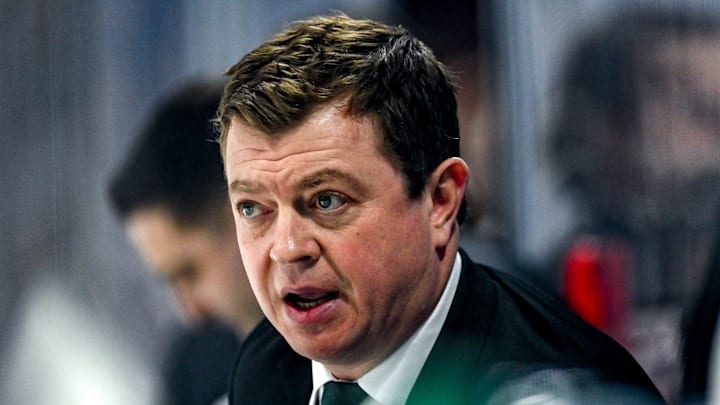 Michigan State's head coach Adam Nightingale talks with players on the bench during the second period in the game against Michigan on Friday, Jan. 19, 2024, at Munn Arena in East Lansing.