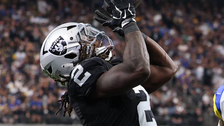 Oct 25, 2026; Paradise, Nevada, USA;  Las Vegas Raiders running back Ashton Jeanty (2) makes a touchdown catch over Los Angeles Rams safety Kam Curl (3)in the second half at Allegiant Stadium.  Mandatory Credit: David Brytus-Imagn Images