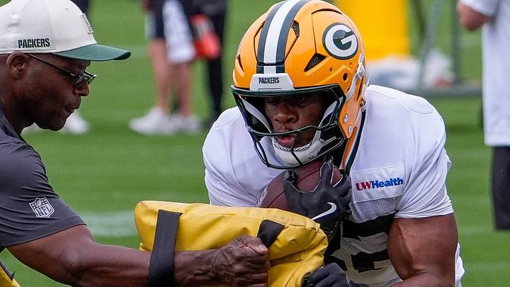 Green Bay Packers running back MarShawn Lloyd goes through drills with position coach Ben Sirmans at training camp. Green Bay Packers running back MarShawn Lloyd goes through drills with position coach Ben Sirmans at training camp.