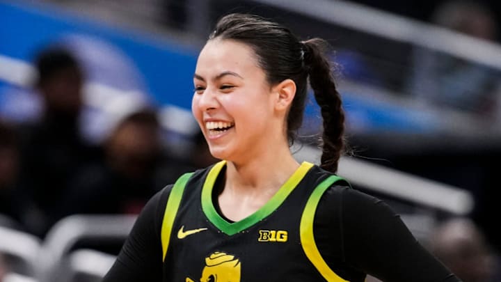 Oregon Ducks guard Ari Long (14) smiles while running to the bench Thursday, March 5, 2026, during a Big Ten women's basketball tournament game at Gainbridge Fieldhouse in Indianapolis. The Oregon Ducks defeated the Maryland Terrapins, 73-68. Oregon Ducks guard Ari Long (14) smiles while running to the bench Thursday, March 5, 2026, during a Big Ten women's basketball tournament game at Gainbridge Fieldhouse in Indianapolis. The Oregon Ducks defeated the Maryland Terrapins, 73-68.