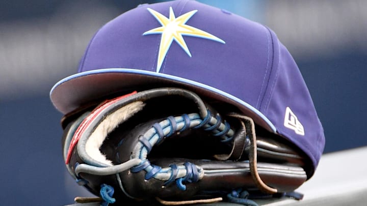 May 14, 2018; Kansas City, MO, USA; A general view of a Tampa Bay Rays hat and glove on the dugout fence before the game against the Kansas City Royals at Kauffman Stadium.