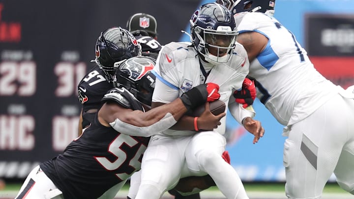 Houston Texans defensive end Danielle Hunter (55) sacks Tennessee Titans quarterback Cam Ward (1) during the first half at NRG Stadium.