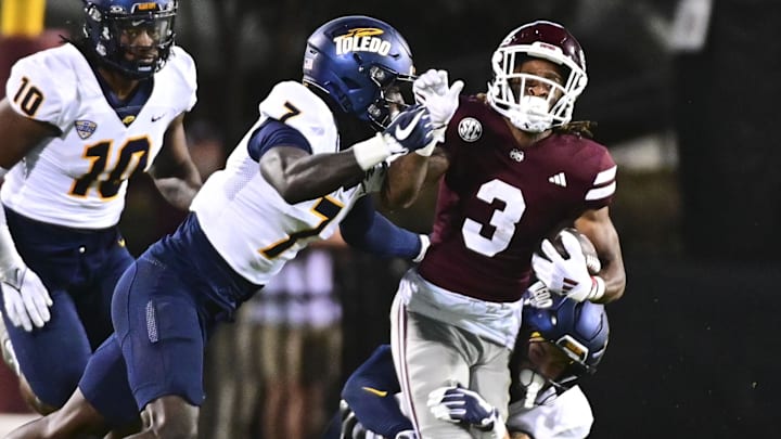 Toledo Rockets S Emmanuel McNeil-Warren tackles Mississippi State Bulldogs WR Kevin Coleman Jr.