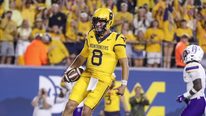 Sep 7, 2024; Morgantown, West Virginia, USA; West Virginia Mountaineers quarterback Nicco Marchiol (8) runs the ball for a touchdown during the fourth quarter against the Albany Great Danes at Mountaineer Field at Milan Puskar Stadium. Mandatory Credit: Ben Queen-Imagn Images Sep 7, 2024; Morgantown, West Virginia, USA; West Virginia Mountaineers quarterback Nicco Marchiol (8) runs the ball for a touchdown during the fourth quarter against the Albany Great Danes at Mountaineer Field at Milan Puskar Stadium. Mandatory Credit: Ben Queen-Imagn Images