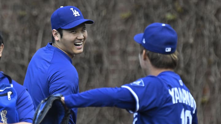 Apr 23, 2025; Chicago, Illinois, USA; Los Angeles Dodgers two-way player Shohei Ohtani (17) laughs with pitcher Yoshinobu Yamamoto (18) before the teams game against the Chicago Cubs at Wrigley Field. Mandatory Credit: Matt Marton-Imagn Images Apr 23, 2025; Chicago, Illinois, USA; Los Angeles Dodgers two-way player Shohei Ohtani (17) laughs with pitcher Yoshinobu Yamamoto (18) before the teams game against the Chicago Cubs at Wrigley Field. Mandatory Credit: Matt Marton-Imagn Images