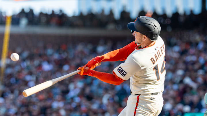 Apr 4, 2025; San Francisco, California, USA; San Francisco Giants catcher Patrick Bailey (14) hits a double during the ninth inning against the Seattle Mariners at Oracle Park. 