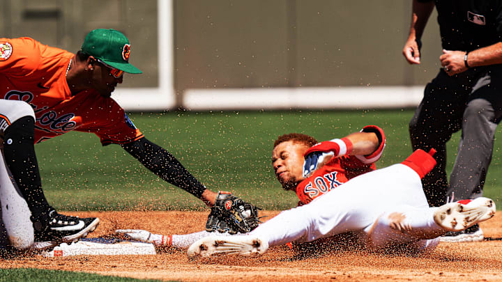 Kristian Campbell, of the Boston Red Sox reacts after sliding safely into second ahead of Luis Vasquez of the Baltimore Orioles during a Spring Training game at JetBlue Park in Fort Myers on Monday, March 17, 2025.