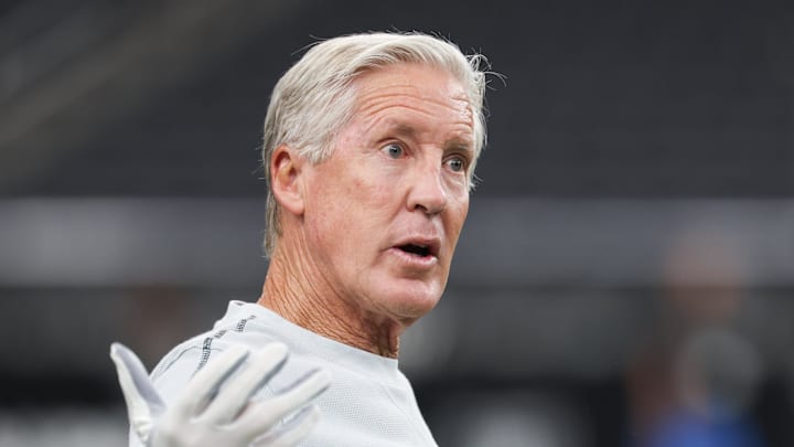 Sep 15, 2025; Paradise, Nevada, USA;  Las Vegas Raiders head coach Pete Carroll throws a football before the game against the Los Angeles Chargers at Allegiant Stadium. Mandatory Credit: Kiyoshi Mio-Imagn Images