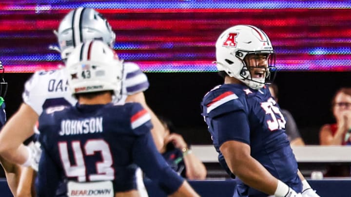 Sep 12, 2025; Tucson, Arizona, USA; Arizona Wildcats defensive lineman Leroy Palu (95) celebrates a tackle against the Kansas State Wildcats during the third quarter of the game at Arizona Stadium. Mandatory Credit: Aryanna Frank-Imagn Images