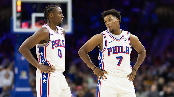 Nov 2, 2024; Philadelphia, Pennsylvania, USA; Philadelphia 76ers guard Tyrese Maxey (0) talks with guard Kyle Lowry (7) during the third quarter against the Memphis Grizzlies at Wells Fargo Center. Mandatory Credit: Bill Streicher-Imagn Images