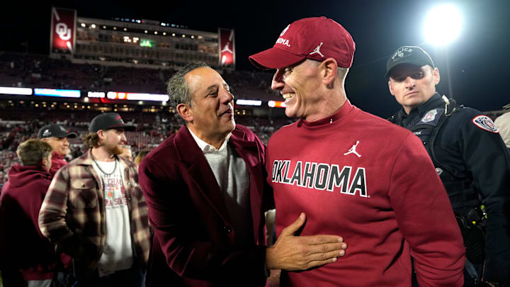 OU President Joseph Harroz Jr celebrates with coach Brent Venables.