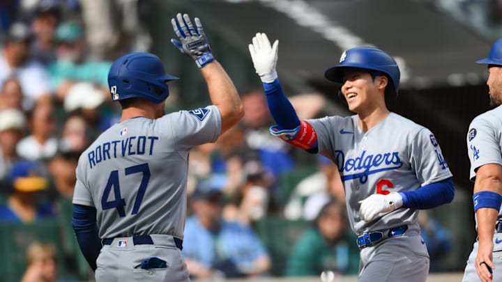 Sep 28, 2025; Seattle, Washington, USA; Los Angeles Dodgers catcher Ben Rortvedt (47) and second baseman Hyeseong Kim (6) celebrate after Kim hit a 2-run home run against the Seattle Mariners during the second inning at T-Mobile Park. Mandatory Credit: Steven Bisig-Imagn Images