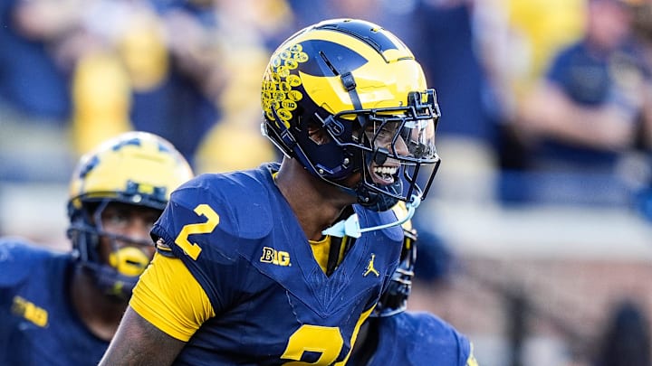 Michigan defensive back Will Johnson (2) celebrates a touchdown after intercepting USC quarterback Miller Moss (7) during the second half at Michigan Stadium in Ann Arbor on Saturday, Sept. 21, 2024.