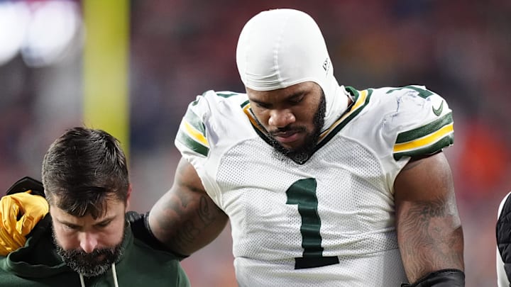 Green Bay Packers defensive end Micah Parsons (1) walks off the field after suffering a knee injury against the Broncos. Green Bay Packers defensive end Micah Parsons (1) walks off the field after suffering a knee injury against the Broncos.