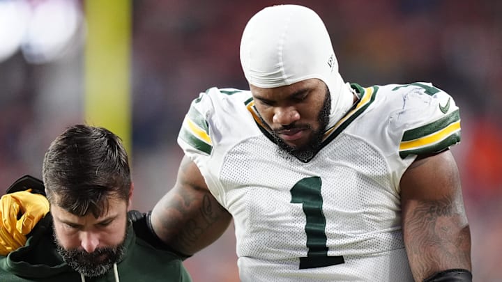 Green Bay Packers defensive end Micah Parsons (1) walks off the field with help from medical personnel after a knee injury. Green Bay Packers defensive end Micah Parsons (1) walks off the field with help from medical personnel after a knee injury.