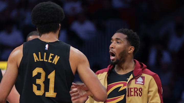 Apr 28, 2025; Miami, Florida, USA; Cleveland Cavaliers guard Donovan Mitchell (45) celebrates with center Jarrett Allen (31) against the Miami Heat in the second quarter during game four for the first round of the 2025 NBA Playoffs at Kaseya Center. Mandatory Credit: Sam Navarro-Imagn Images