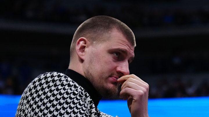 Jan 29, 2026; Denver, Colorado, USA; Denver Nuggets center Nikola Jokic (15) watches game play in the fourth quarter against the Brooklyn Nets at Ball Arena. Mandatory Credit: Ron Chenoy-Imagn Images