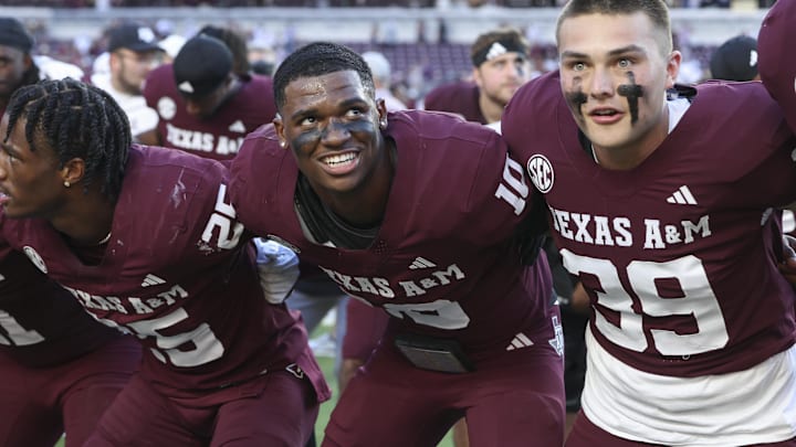 Texas A&M Aggies quarterback Marcel Reed (10) celebrates with teammates after the game against the Auburn Tigers at Kyle Field. Texas A&M Aggies quarterback Marcel Reed (10) celebrates with teammates after the game against the Auburn Tigers at Kyle Field.