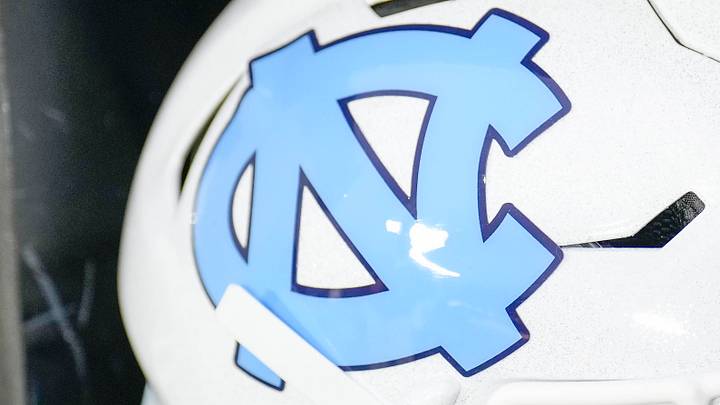 Dec 27, 2023; Charlotte, NC, USA; North Carolina Tar Heels white helmet during pregame warm ups against the West Virginia Mountaineers at Bank of America Stadium. Mandatory Credit: Jim Dedmon-USA TODAY Sports Dec 27, 2023; Charlotte, NC, USA; North Carolina Tar Heels white helmet during pregame warm ups against the West Virginia Mountaineers at Bank of America Stadium. Mandatory Credit: Jim Dedmon-USA TODAY Sports