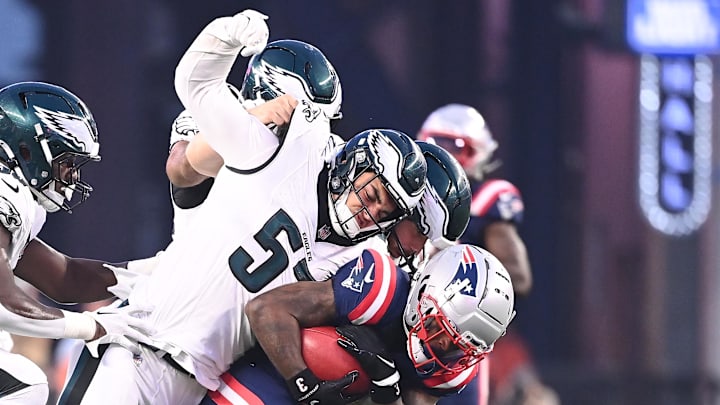 Philadelphia Eagles linebacker Ben VanSumeren (57) tackles New England Patriots wide receiver DeMario Douglas (3) during the first half at Gillette Stadium. Philadelphia Eagles linebacker Ben VanSumeren (57) tackles New England Patriots wide receiver DeMario Douglas (3) during the first half at Gillette Stadium.