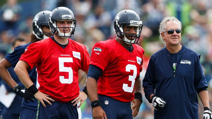 Jul 30, 2016; Renton, WA, USA; Seattle Seahawks quarterback Jake Heaps (5) and quarterback Russell Wilson (3) and quarterbacks coach Carl Smith watch a drill during training camp at the Virginia Mason Athletic Center. Mandatory Credit: Joe Nicholson-USA TODAY Sports Jul 30, 2016; Renton, WA, USA; Seattle Seahawks quarterback Jake Heaps (5) and quarterback Russell Wilson (3) and quarterbacks coach Carl Smith watch a drill during training camp at the Virginia Mason Athletic Center. Mandatory Credit: Joe Nicholson-USA TODAY Sports