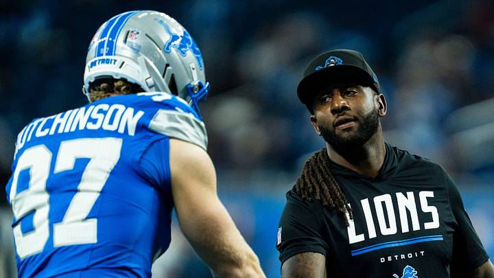 Detroit Lions defensive end Aidan Hutchinson (97) shakes hands with defensive coordinator Kelvin Sheppard ahead of a game against the New Orleans Saints at Ford Field in Detroit on Sunday Sept. 13, 2026.