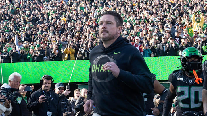 Oregon coach Dan Lanning leads his team onto the field for their game against Southern California Nov. 22, 2025. Oregon coach Dan Lanning leads his team onto the field for their game against Southern California Nov. 22, 2025.