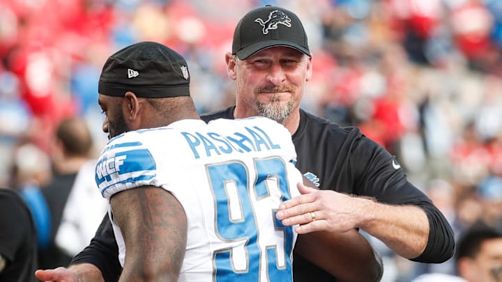 Detroit Lions coach Dan Campbell hugs defensive lineman Josh Paschal (93)