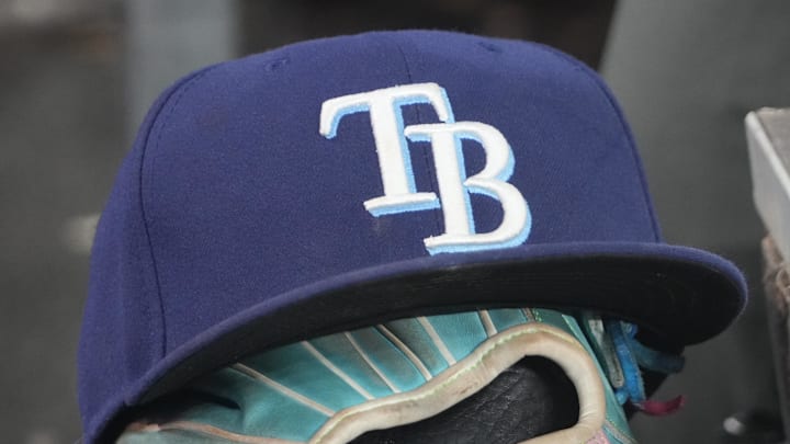 Sep 26, 2025; Toronto, Ontario, CAN; The hat and glove of Tampa Bay Rays third baseman Junior Caminero (13) in the dugout during the game against the Toronto Blue Jays at Rogers Centre. 