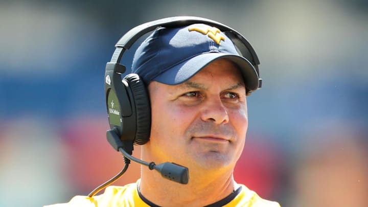 Sep 16, 2017; Morgantown, WV, USA; West Virginia Mountaineers defensive coordinator Tony Gibson walks along the sidelines during the first quarter against the Delaware State Hornets at Milan Puskar Stadium. Mandatory Credit: Ben Queen-Imagn Images
