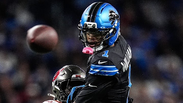 Detroit Lions WR Jameson Williams (1) misses a pass intended for him against Buccaneers safety Tykee Smith (23) 