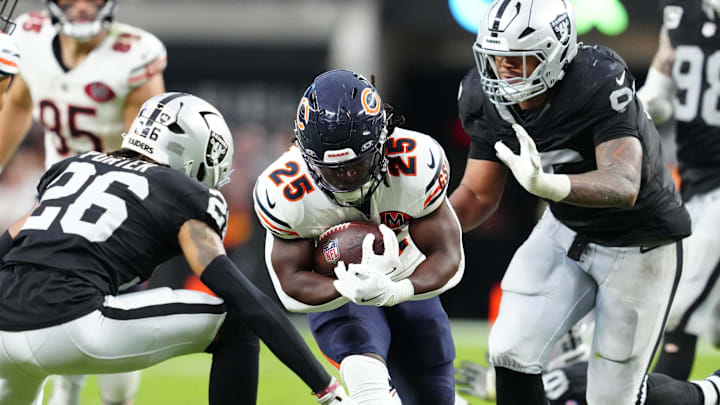 Sep 28, 2025; Paradise, Nevada, USA; Chicago Bears running back Kyle Monangai (25) runs the ball against Las Vegas Raiders cornerback Darien Porter (26) during the second half at Allegiant Stadium. Mandatory Credit: Stephen R. Sylvanie-Imagn Images