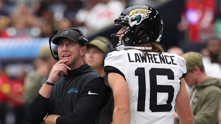 Nov 9, 2025; Houston, Texas, USA; Jacksonville Jaguars head coach Liam Coen and quarterback Trevor Lawrence (16) on the sidelines during the first half against the Houston Texans at NRG Stadium. Mandatory Credit: Thomas Shea-Imagn Images