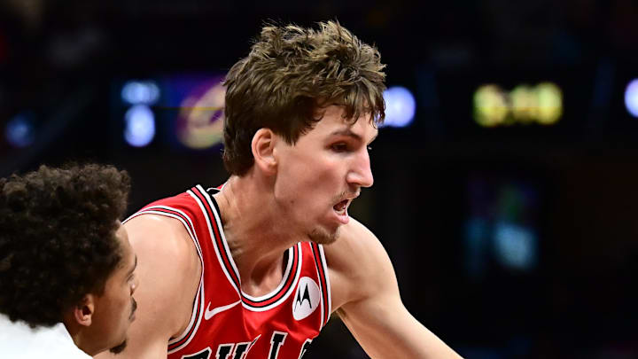 Oct 7, 2025; Cleveland, Ohio, USA; Cleveland Cavaliers guard Craig Porter Jr. (9) goes for a loose ball against Chicago Bulls forward Matas Buzelis (14) during the second half at Rocket Arena. Mandatory Credit: Ken Blaze-Imagn Images