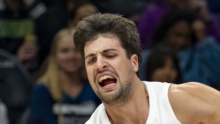 Portland Trail Blazers forward Deni Avdija dribbles the ball past Minnesota Timberwolves guard Anthony Edwards.