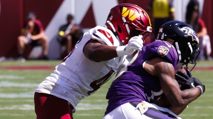Aug 23, 2025; Landover, Maryland, USA; Baltimore Ravens cornerback Keyon Martin (38) is being tackled by the Washington Commanders linebacker Kam Arnold (46) in the fourth quarter at Northwest Stadium. Mandatory Credit: Jordyn Harris-Imagn Images Aug 23, 2025; Landover, Maryland, USA; Baltimore Ravens cornerback Keyon Martin (38) is being tackled by the Washington Commanders linebacker Kam Arnold (46) in the fourth quarter at Northwest Stadium. Mandatory Credit: Jordyn Harris-Imagn Images