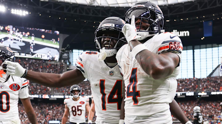 Chicago Bears running back D'Andre Swift (4) celebrates a touchdown with wide receiver Olamide Zaccheaus (14) during the second half against the Las Vegas Raiders at Allegiant Stadium.