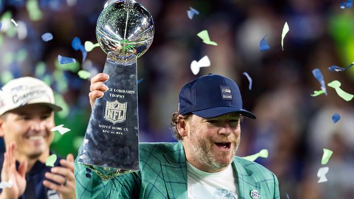 Feb 8, 2026; Santa Clara, CA, USA; Seattle Seahawks general manager John Schneider celebrates with the Vince Lombardi trophy on the podium after defeating the New England Patriots in Super Bowl LX at Levi's Stadium. Mandatory Credit: Mark J. Rebilas-Imagn Images Feb 8, 2026; Santa Clara, CA, USA; Seattle Seahawks general manager John Schneider celebrates with the Vince Lombardi trophy on the podium after defeating the New England Patriots in Super Bowl LX at Levi's Stadium. Mandatory Credit: Mark J. Rebilas-Imagn Images